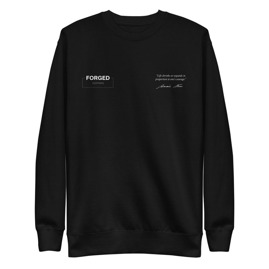 Forged Definition Crewneck negra, vista delantera con el logo Forged Clothing y la frase de Anaïs Nin